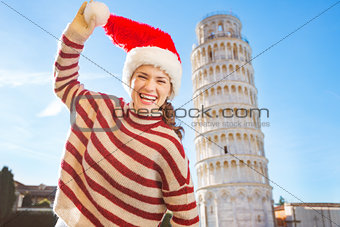 Laughing woman in Santa hat in front of Leaning Tour of Pisa