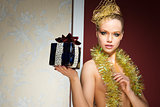 sexy girl with tinsel and xmas gift 