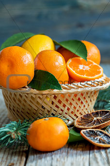 Tangerines and lemons in the basket.