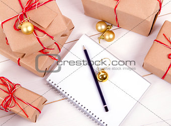 wish list in to notebook near christmas gifts