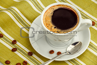 Black coffee in white porcelain cup