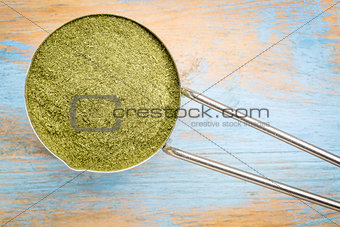 scoop of  wheat grass powder