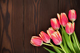Colorful tulips over wooden table