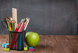 School and office supplies and apple