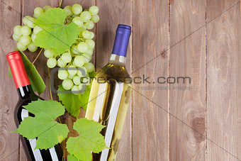 Bunch of grapes and wine bottles