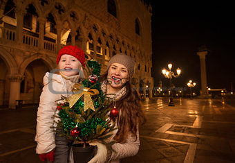 Mother and child with Christmas tree on Piazza San Marco, Venice
