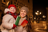 Mother and child with Italian flag on Piazza San Marco in Venice