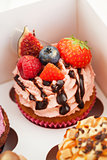 Delicious cupcake decorated with fresh berries