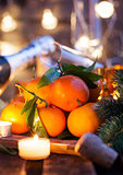 Fresh tangerines on holiday background