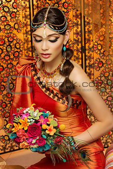 Oriental bride with bouquet