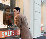 woman at window shop jewellery