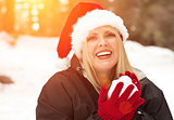 Attractive Santa Hat Wearing Blond Woman Having Fun in Snow
