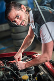 Car mechanic in auto repair service