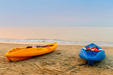 two kayaks on the beach early in the morning