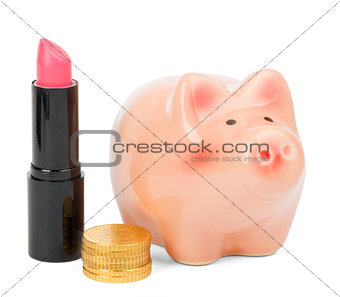 Lipstick with piggy bank and coins