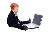 Happy boy using laptop computer
