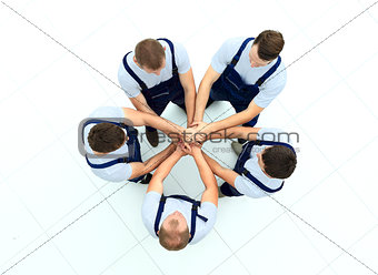 Large group of workers standing in circle