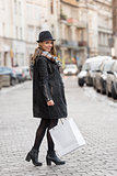 urban girl going for shop in winter sale