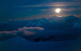 moon night in snowy mountains