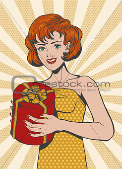 Red haired Girl in retro style holding gift box
