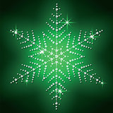 Christmas snowflake on a green background. 