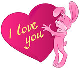 Pink rabbit embraces the heart. I love you