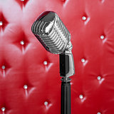 Microphone on red background