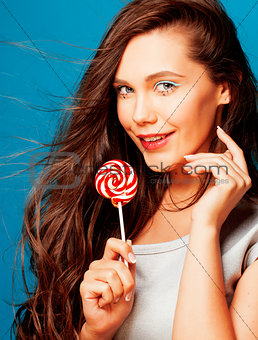 young pretty adorable woman with candy close up like doll