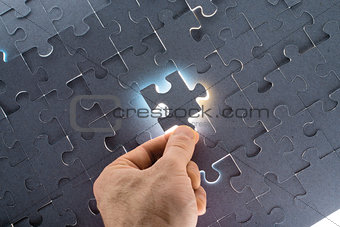 Man holding puzzle piece