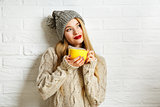 Romantic Dreaming Winter Hipster Girl with a Mug