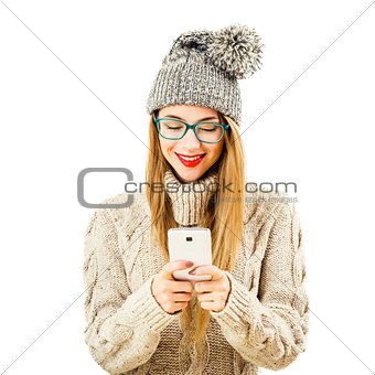 Smiling Winter Hipster Girl in with Mobile Phone on White