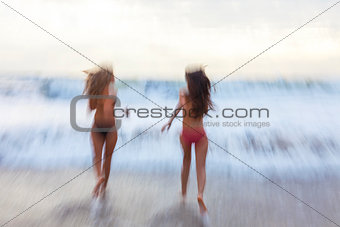 Motion Blur Girls Women Running on Beach