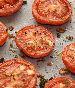 Roast tomatoes, seasoned with thyme and garlic