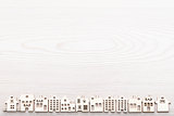 little village of house wooden figures aligned on a surface in w
