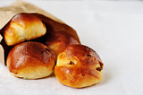Sultana buns in a paper bag