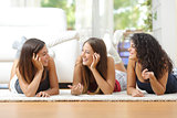 Group of teen friends talking at home