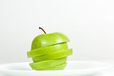 Slices of green apple in a  plate
