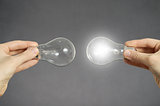 Decision making concept, hands with light bulbs