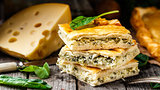 Homemade pie stuffed with cheese and spinach