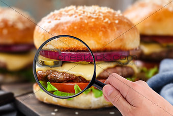 Magnifying glass examining burger 