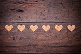 Small hearts on a wooden background