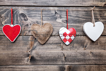 Love concept. Hearts hanging on a string