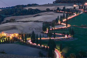 Evening landscapes with car headlights
