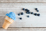 Top view blue ice cream in waffle cone 