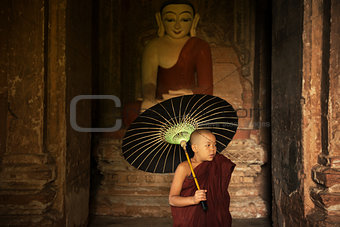 Buddhist novice monk inside monastery
