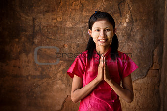 Young Myanmar girl praying