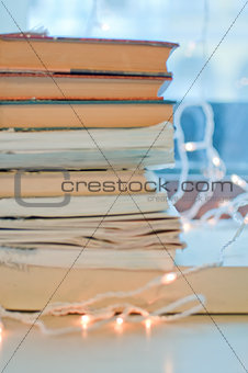 Stack of books and garland
