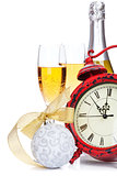 Champagne, christmas decor and alarm clock