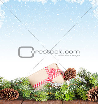 Christmas tree on wooden table with snow background