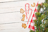Christmas candy cane, gingerbread cookies and snow fir tree